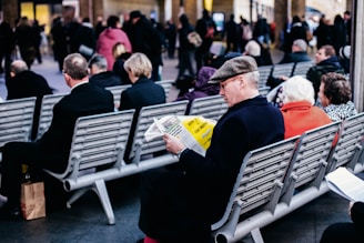 people reading on grey gang chairs