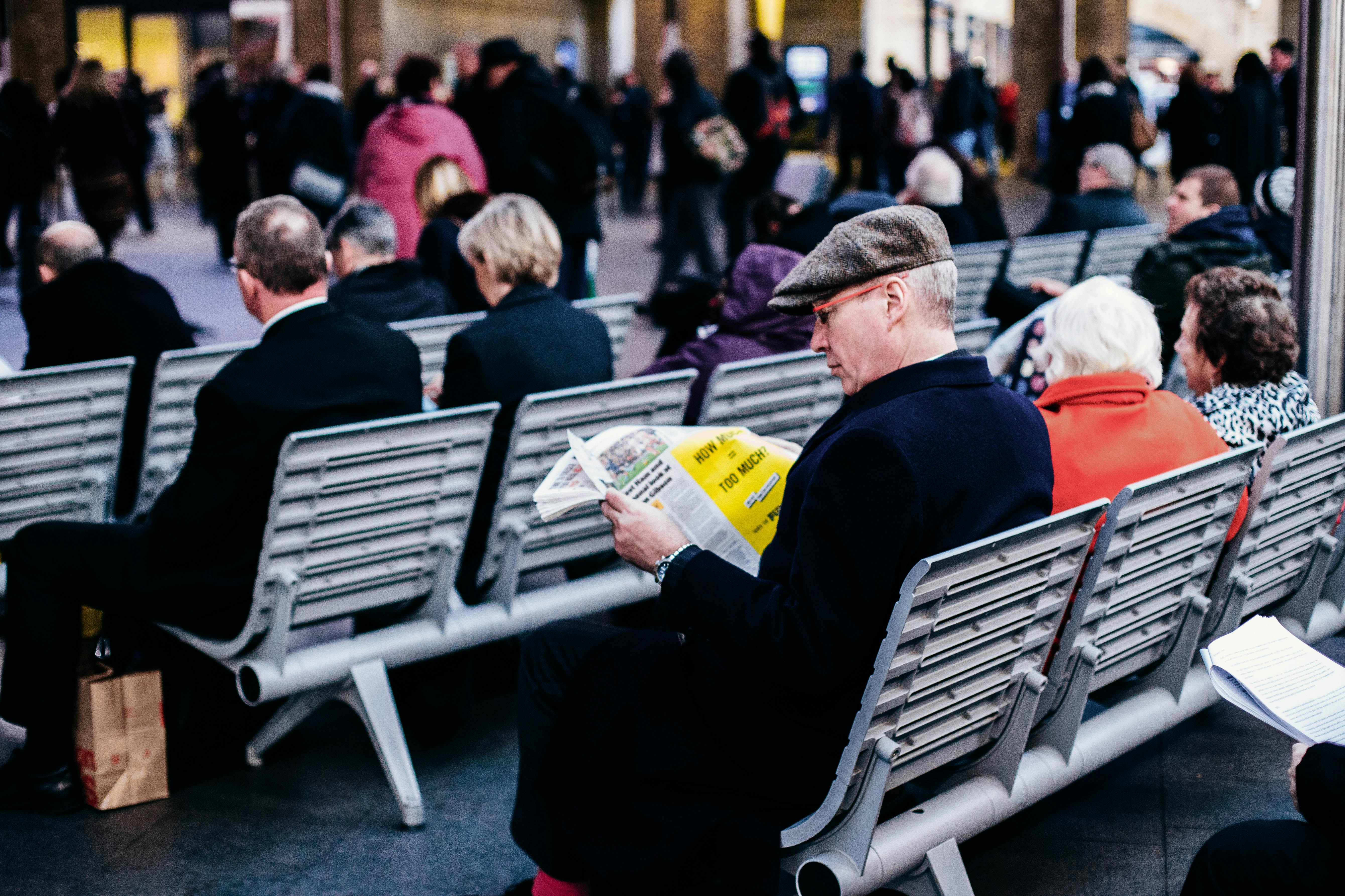 people reading on grey gang chairs