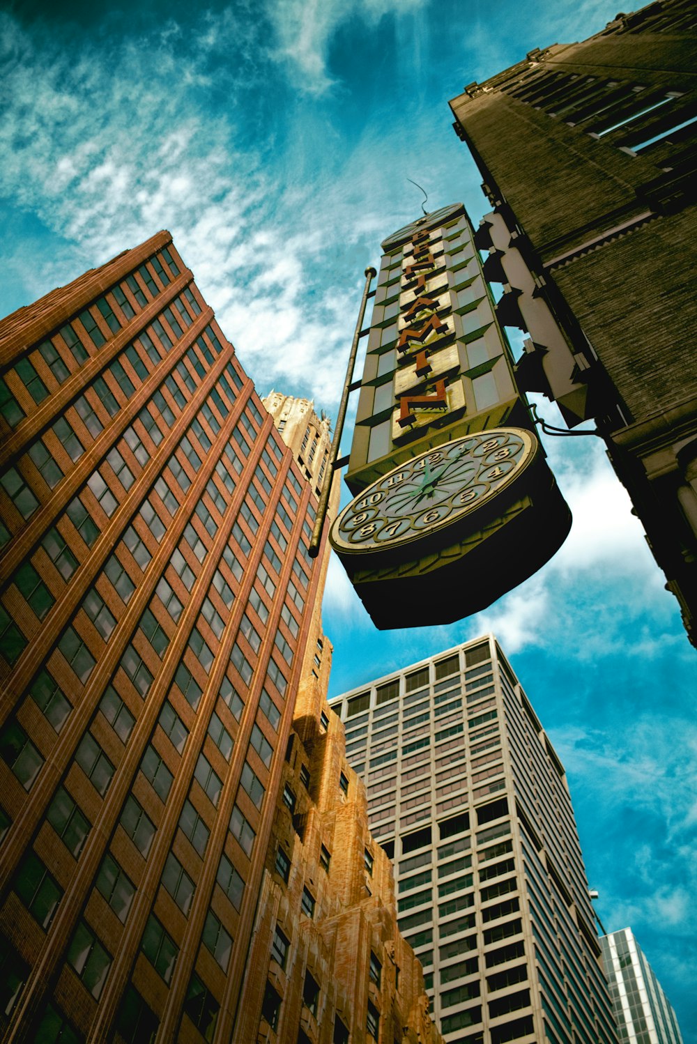 worm's eye view of city clock