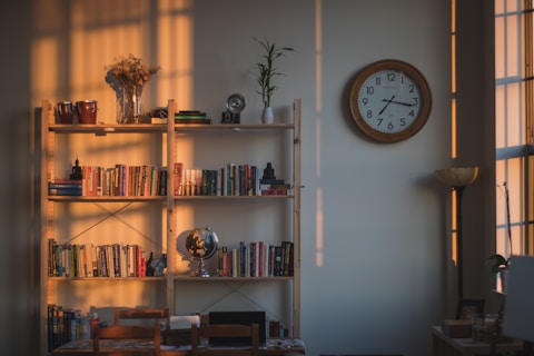 brown wooden double bookcase