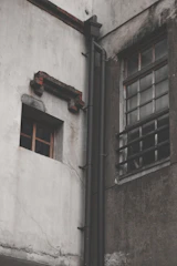 Exterior facade showing repaired cracks and moisture damage after professional restoration.