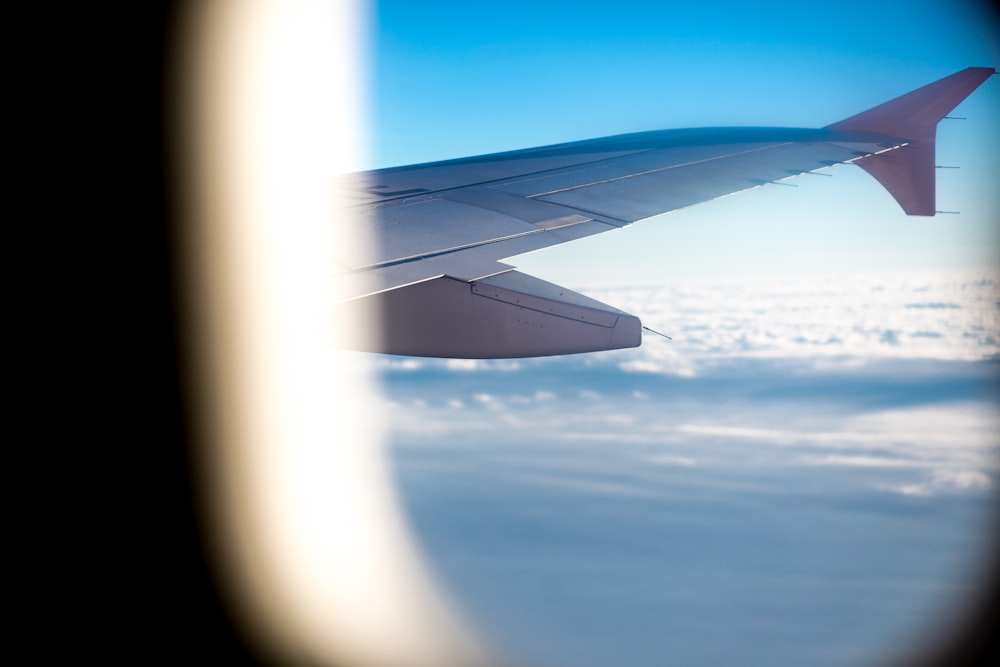 window view of right wing of airplane