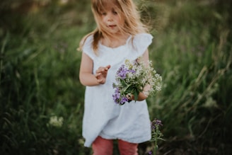 girl holding bouquet of flowers