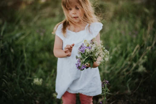 girl holding bouquet of flowers
