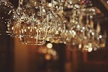 selective focus photo of line of clear drinking glasses