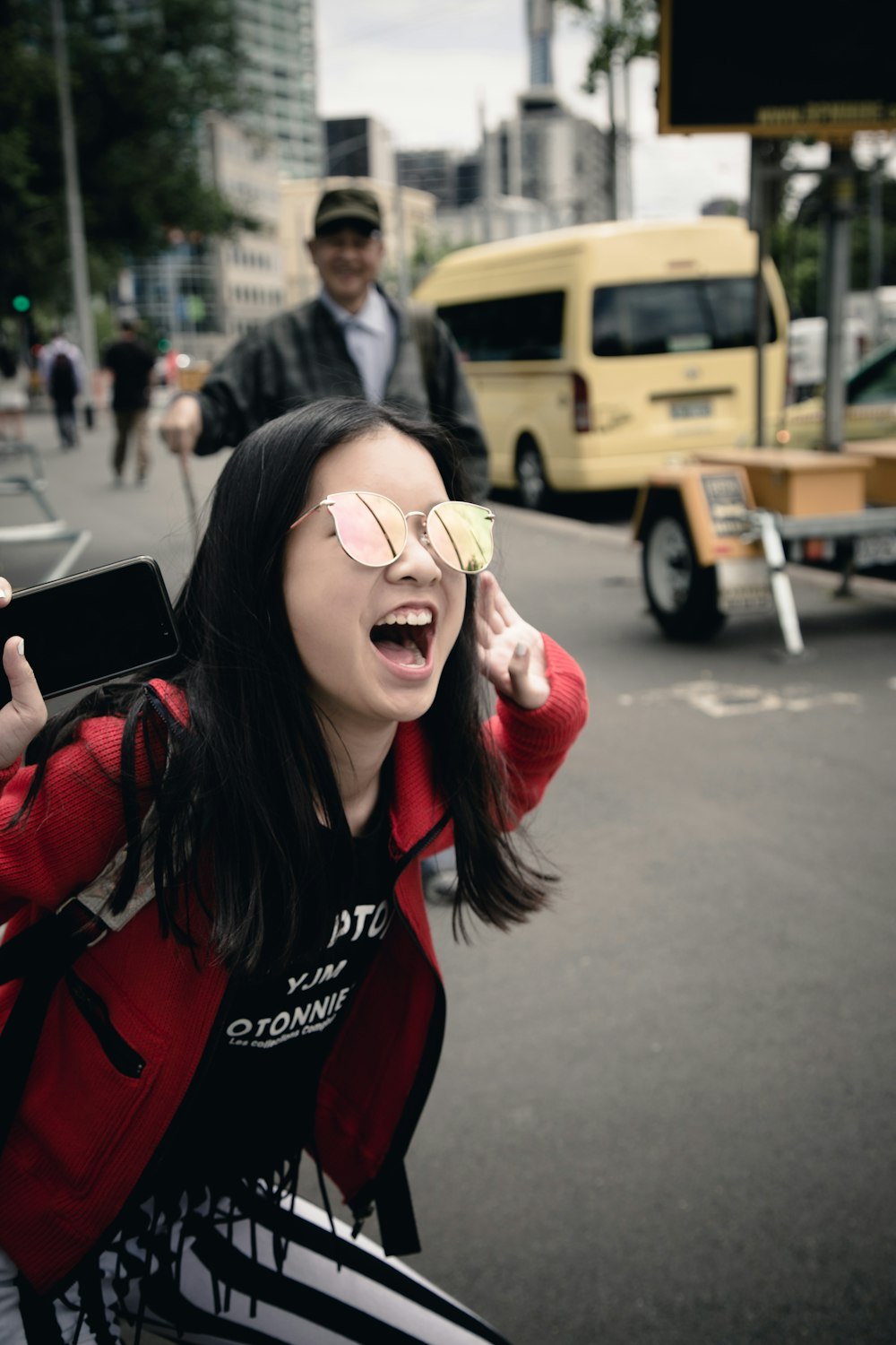 selective focus photography of woman shouting on road