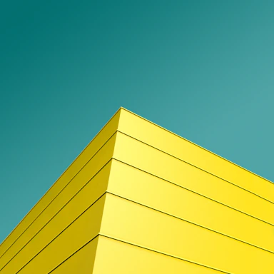 low angle photo of yellow and black striped building's corner
