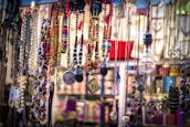 A vibrant display of gold and silver necklaces hanging elegantly.