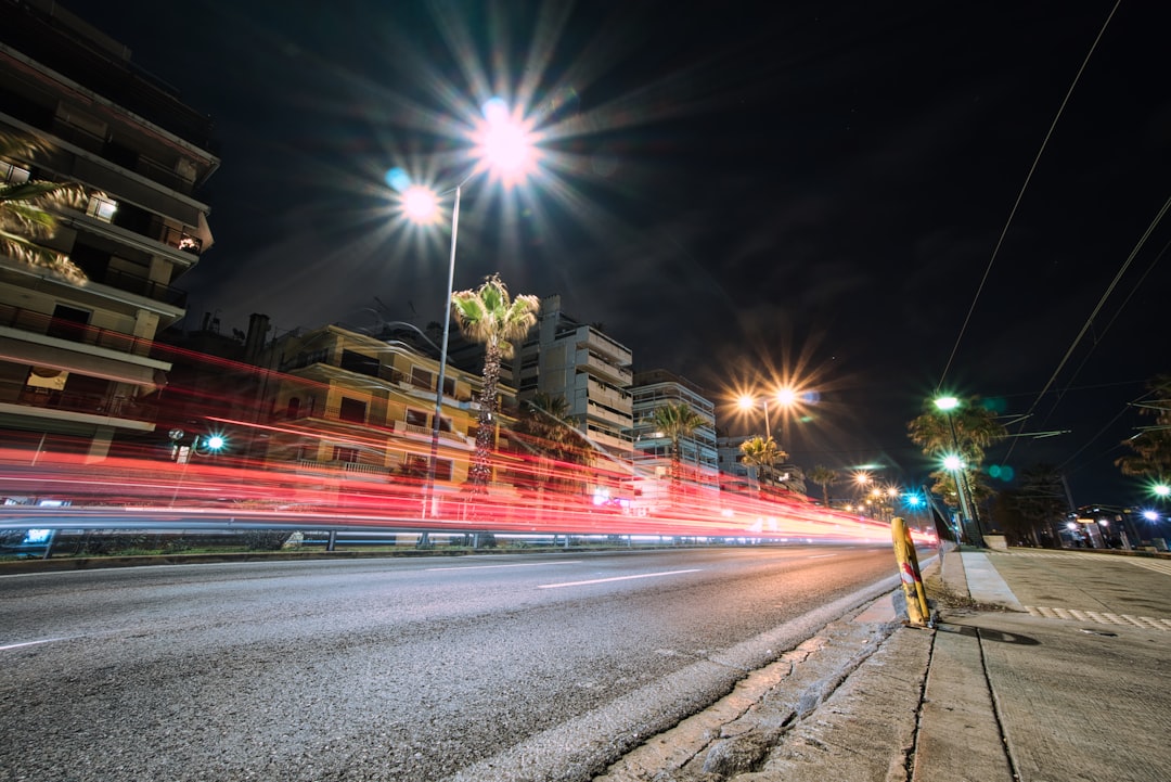 timelapse photography of road and highrise buildings