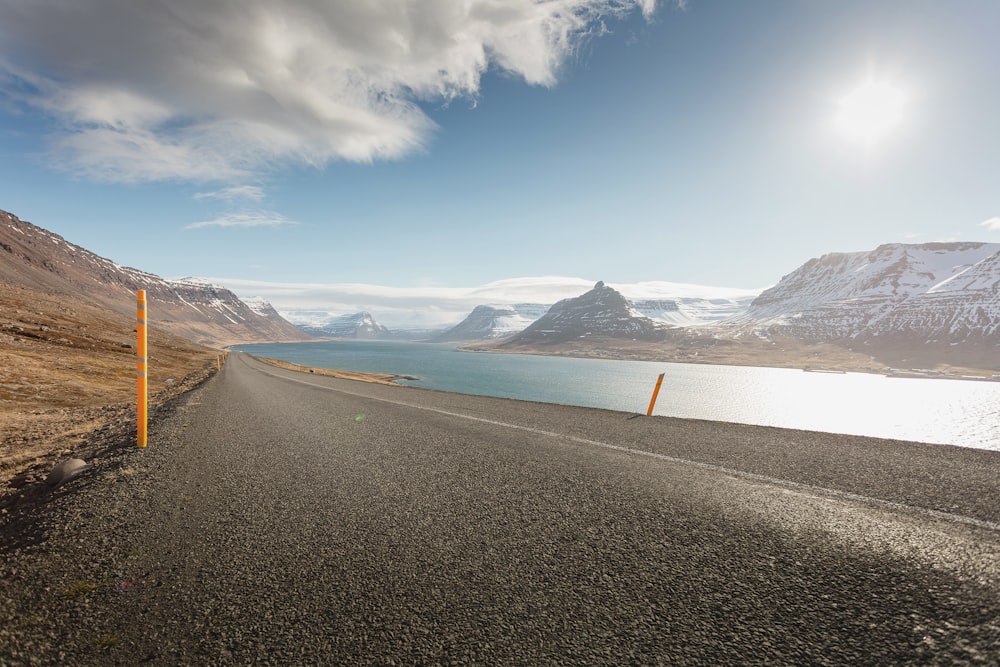 road beside body of water