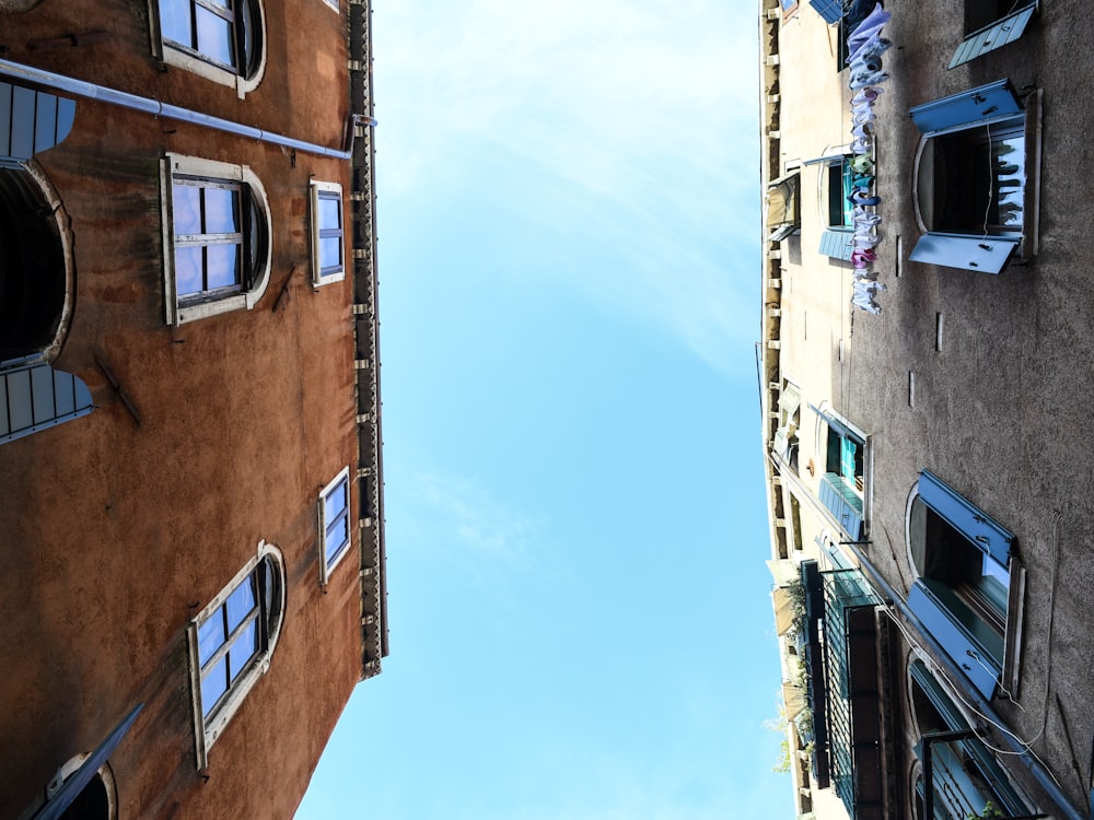 low-angle photography of two concrete establishments