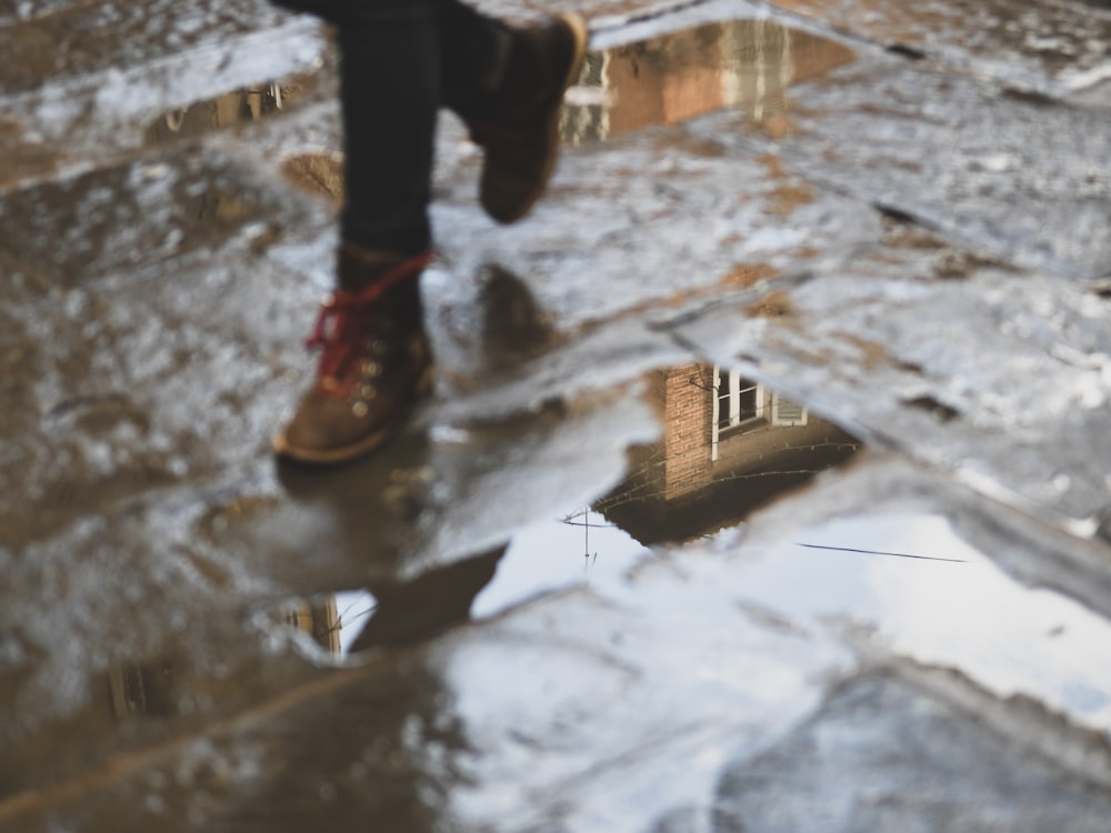 child walking on wet floor