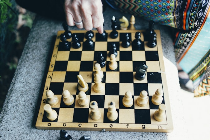 Player focused intently on a chess position during a competitive match