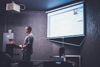 person standing in front of brown lectern