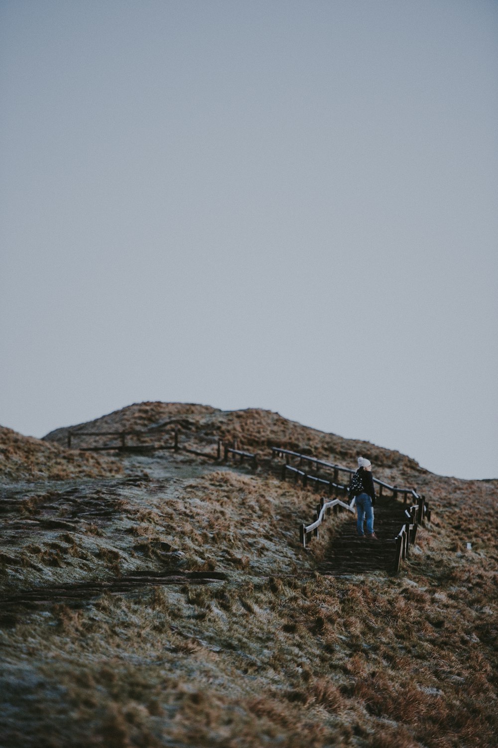 low-angle photography of person walking on stairs