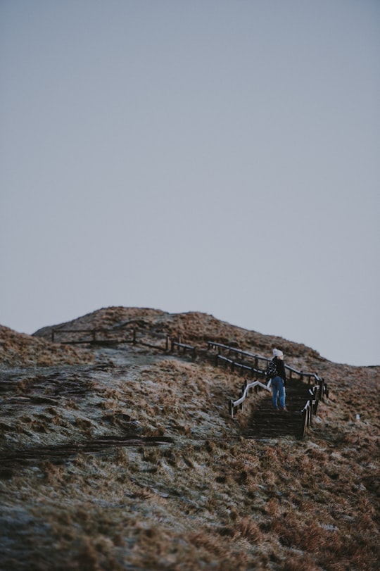 low-angle photography of person walking on stairs in Mam Tor United Kingdom