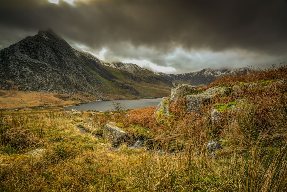 landscape photography of mountain under cloudy sky