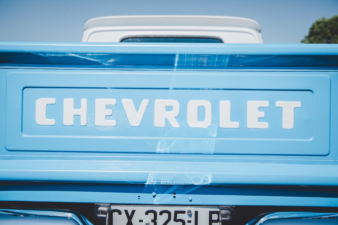 teal Chevrolet pickup truck's tailgate closeup photo