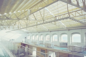 Open-plan commercial interior with refined materials, soft lighting, and a spacious layout