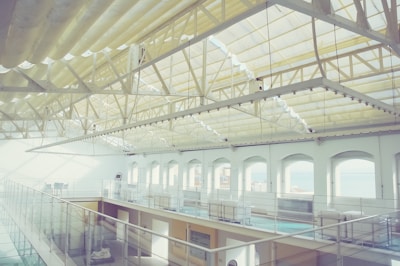 A serene interior space illuminated by natural light through large windows.