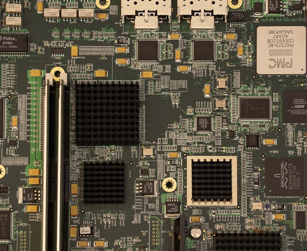 closeup photography of green and black computer motherboard