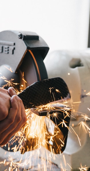 person welding steel