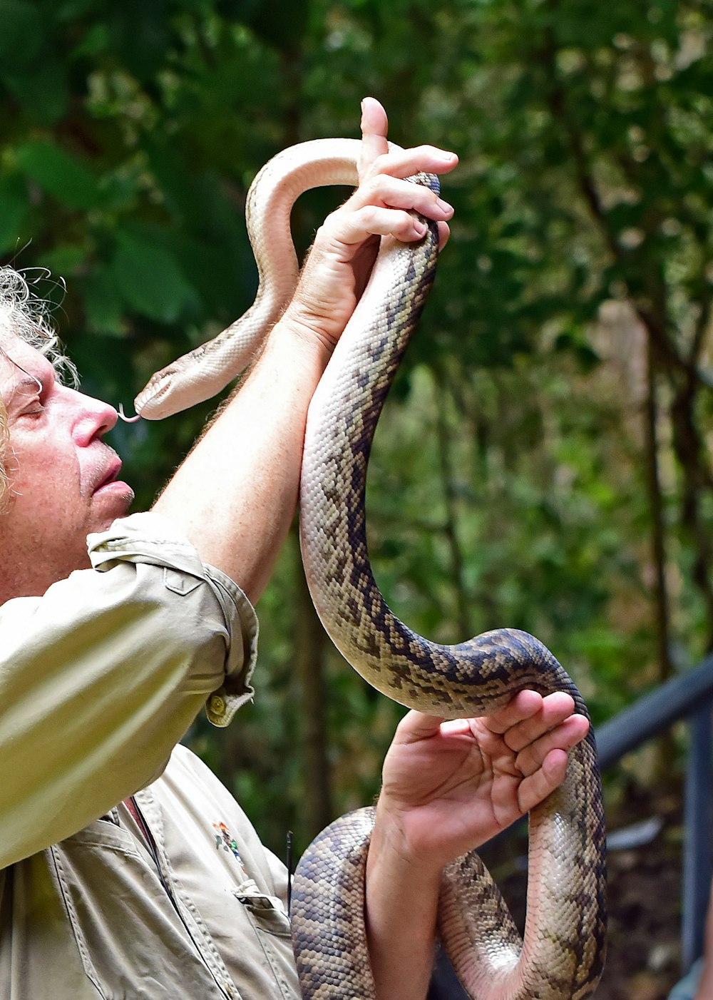 man holding snake