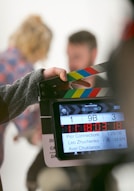 person holding clapperboard