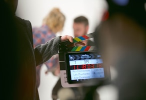 person holding clapperboard