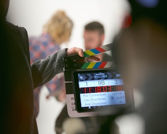 person holding clapperboard