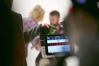 person holding clapperboard transforming delay to action
