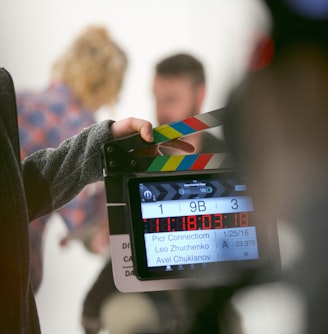 person holding clapperboard