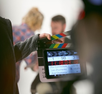 person holding clapperboard