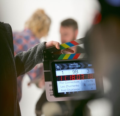 person holding clapperboard