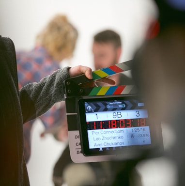 person holding clapperboard