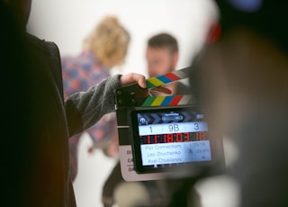 person holding clapperboard