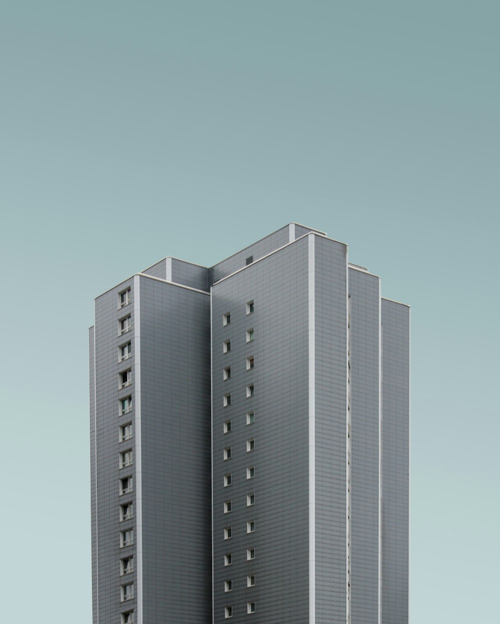 low-angle photography of gray concrete building