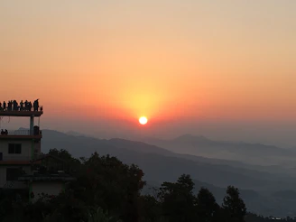 Sunrise view over Mount Bromo with tourists enjoying the scenery