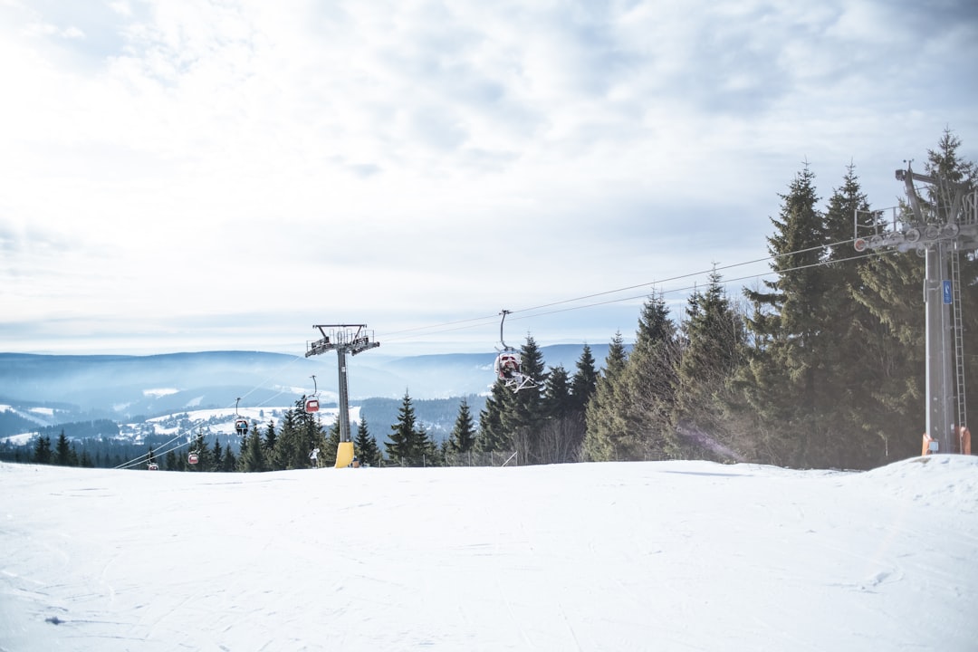 ski lift crossing mountains,