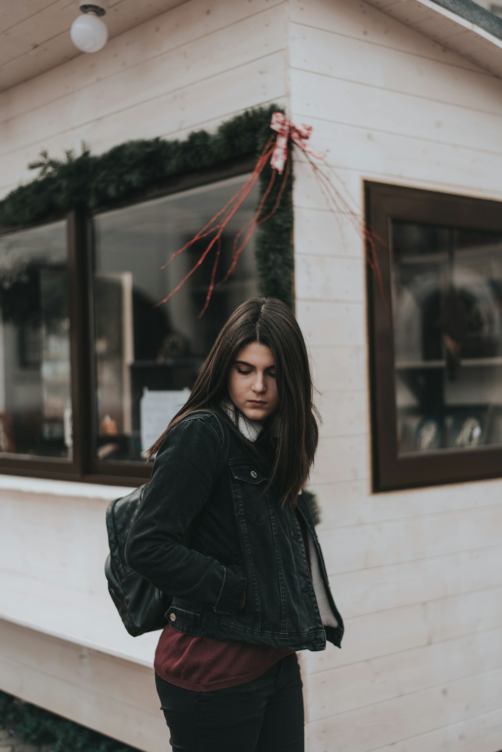 woman standing near store during daytime