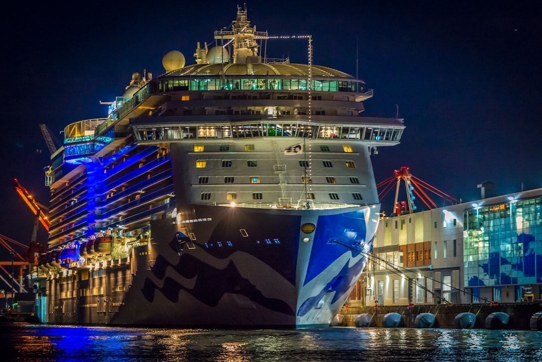 cruise ship dock on pier, I was out on the water taking photos of the supermoon rising and was returning to the marina when I noticed this lovely image of Regal Princess all lit up and reflected in the glass on the pier.