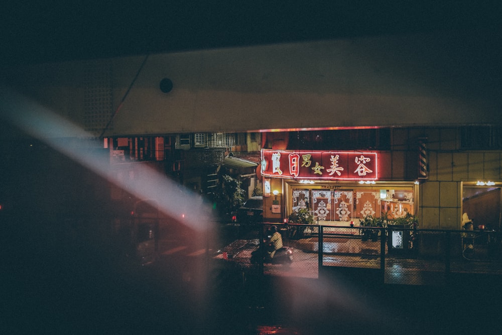 person passing through store facade