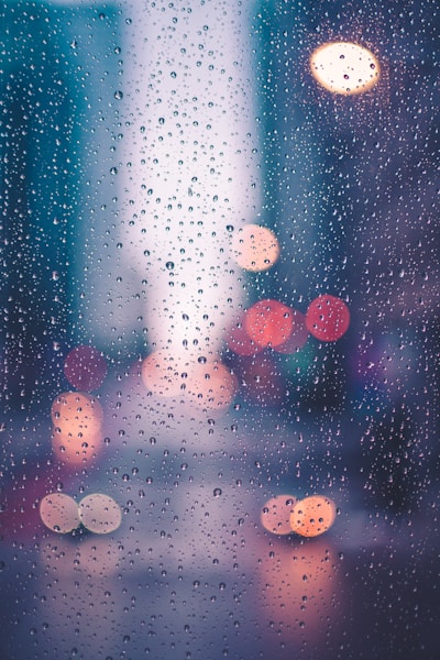 Rain droplets on glass at dusk