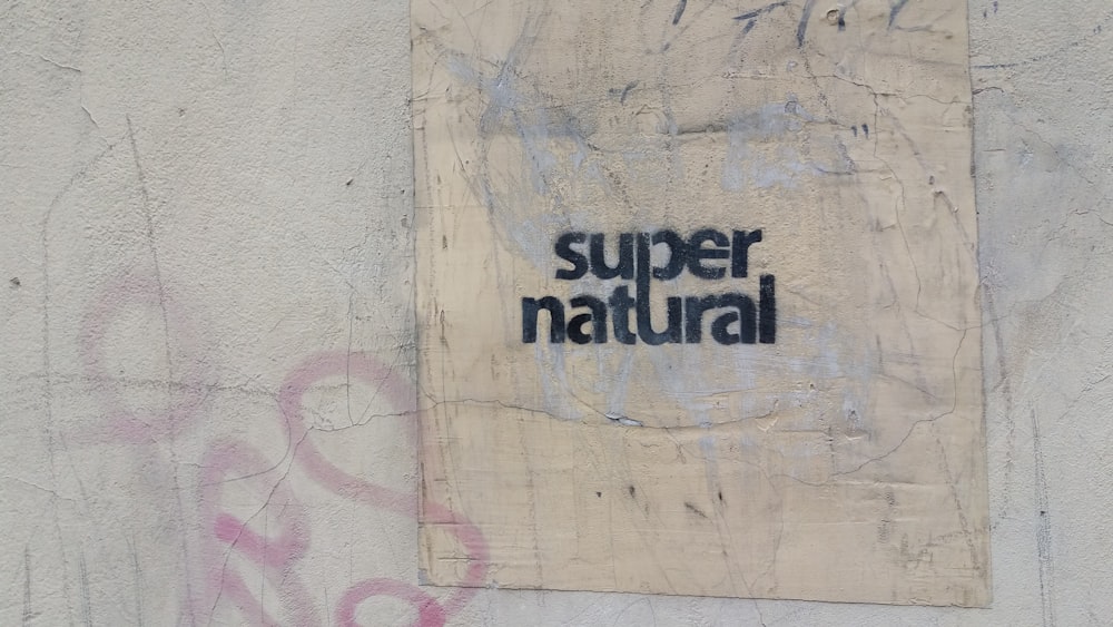 a piece of paper with the words super natural on it