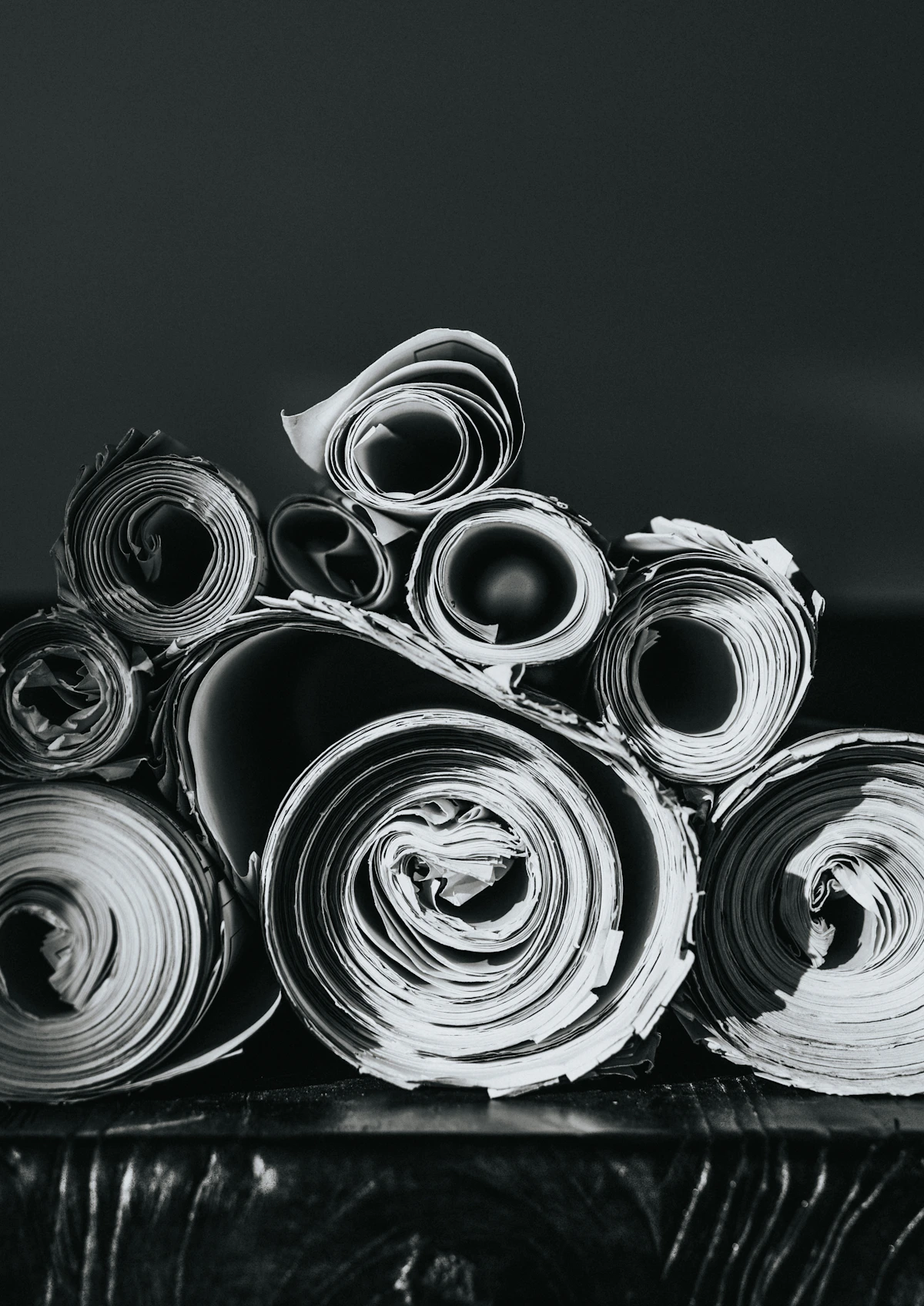 Stacked large paper rolls in a paper mill warehouse ready for transport