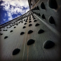 Close-up of nit rivets being installed on a car body.