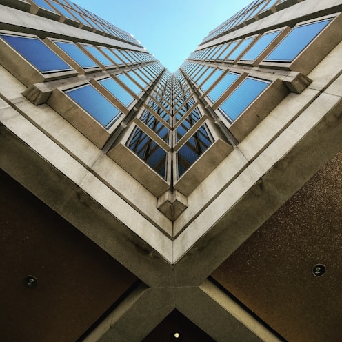 low angle view photography of brown high rise building