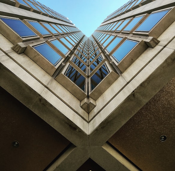 low angle view photography of brown high rise building