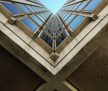 low angle view photography of brown high rise building