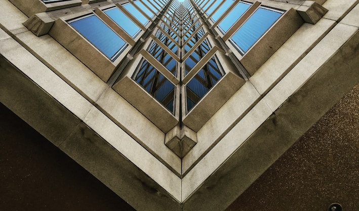 low angle view photography of brown high rise building